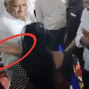 Minister slaps a woman in the face